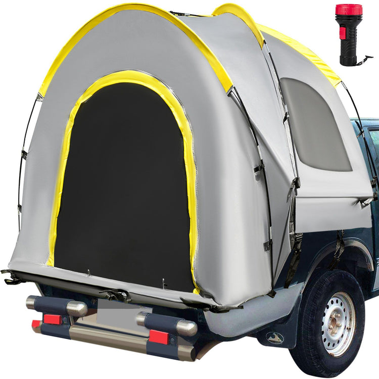 Grey dome-style truck bed tent with yellow trim and an arched mesh-lined door mounted on a pickup's cargo bed