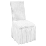 white spandex folding chair covers row at a wedding reception