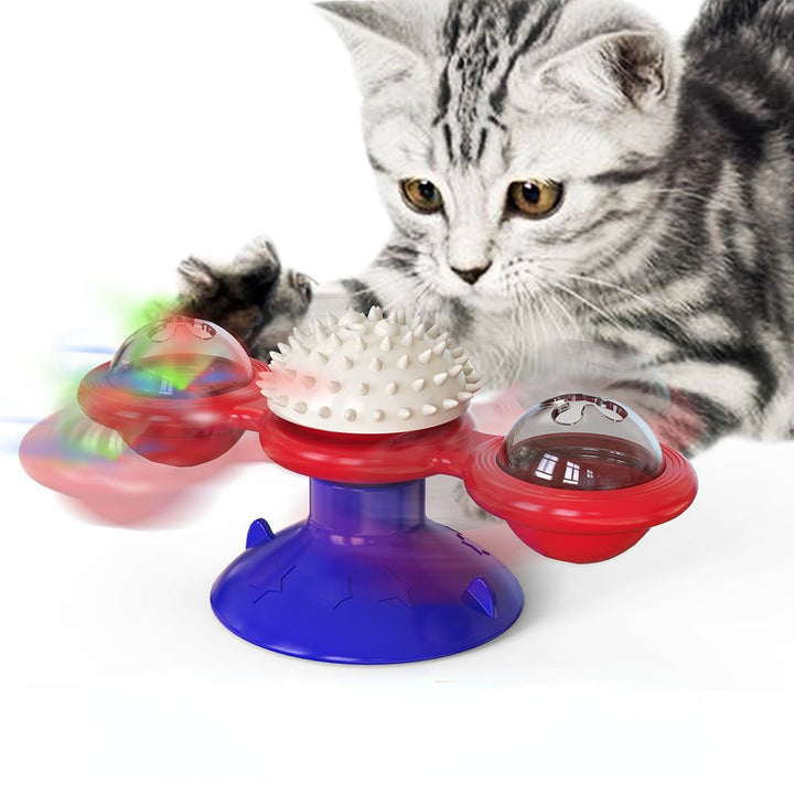 Cat playing with interactive spinning windmill toy