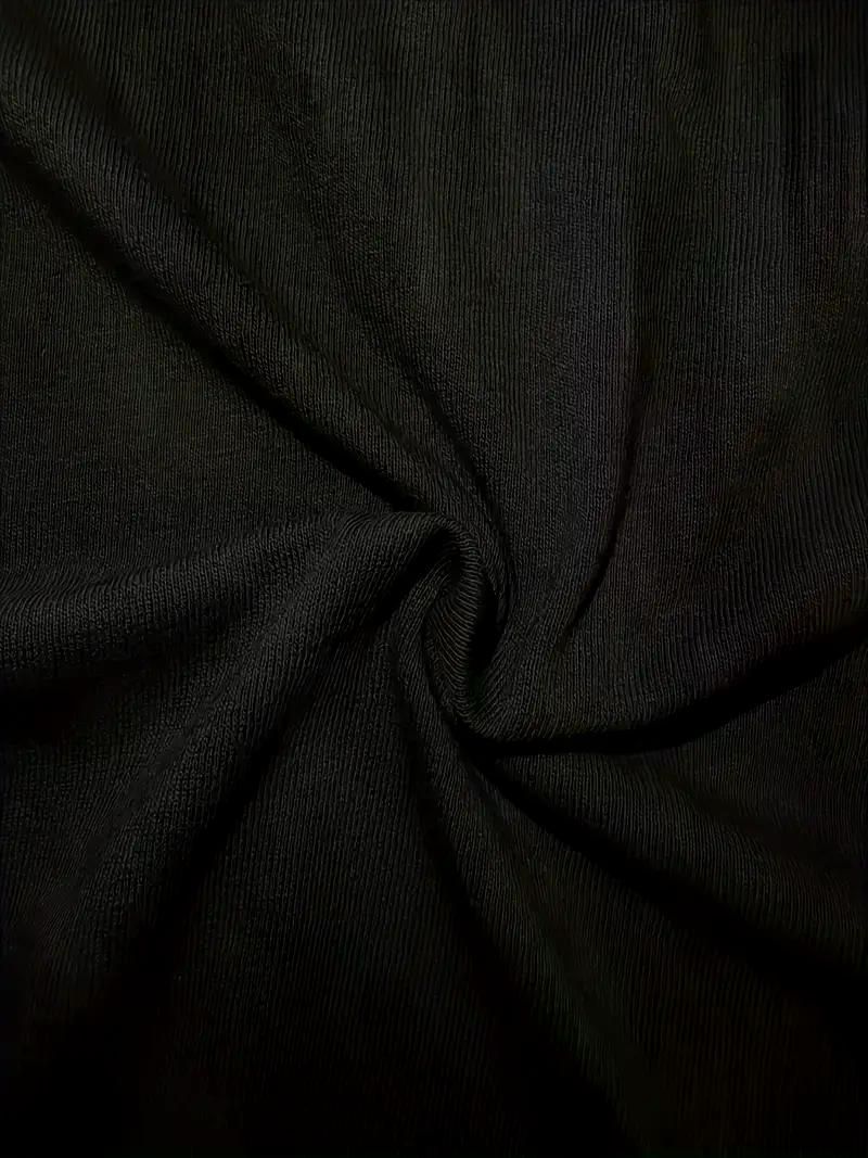 Black faith tee worn with jeans