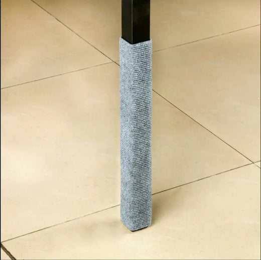 Cat scratching the wall corner mat with claws extended