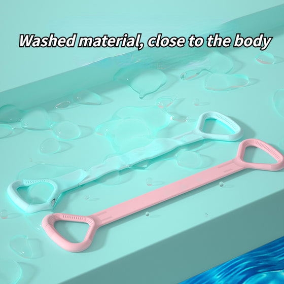Pink and mint yoga bands laid on a wet surface highlighting the smooth material
