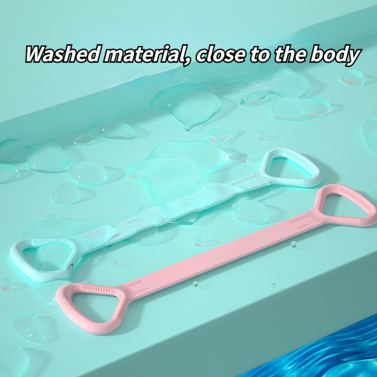 Pink and mint yoga bands laid on a wet surface highlighting the smooth material
