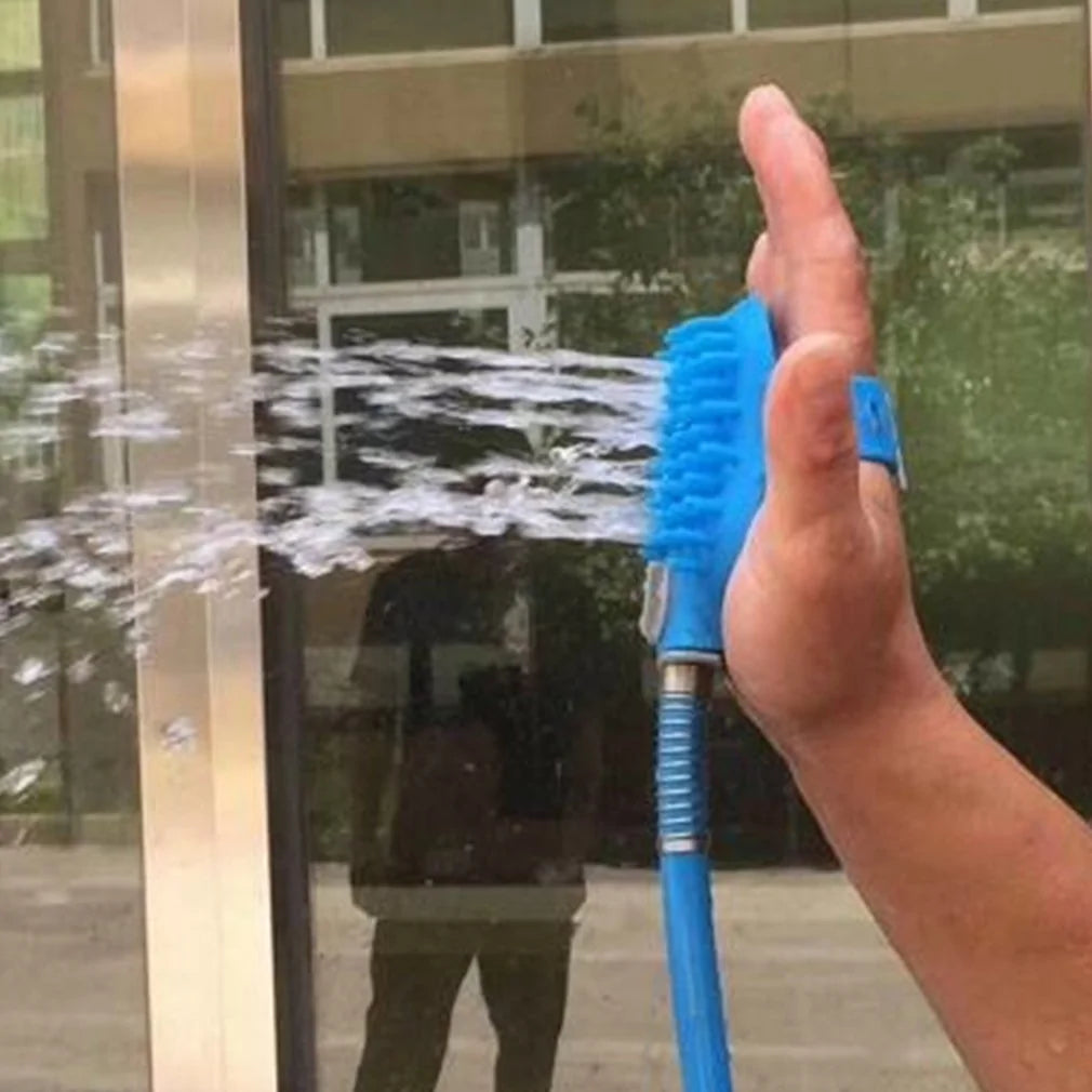 Pet massage shower head attached to a garden hose