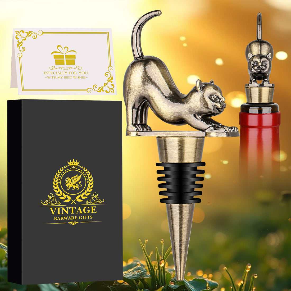 Dark silver upturned cat wine stopper beside black gift box and greeting card