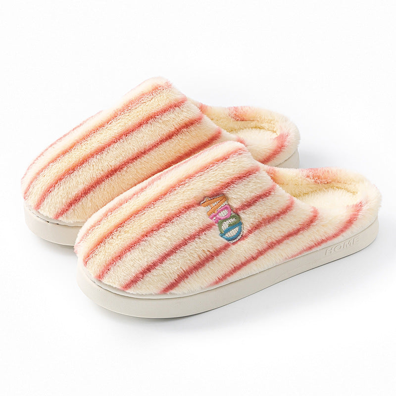 Pink striped plush slippers with an embroidered letter patch