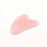 Gua sha tool in pink jade color