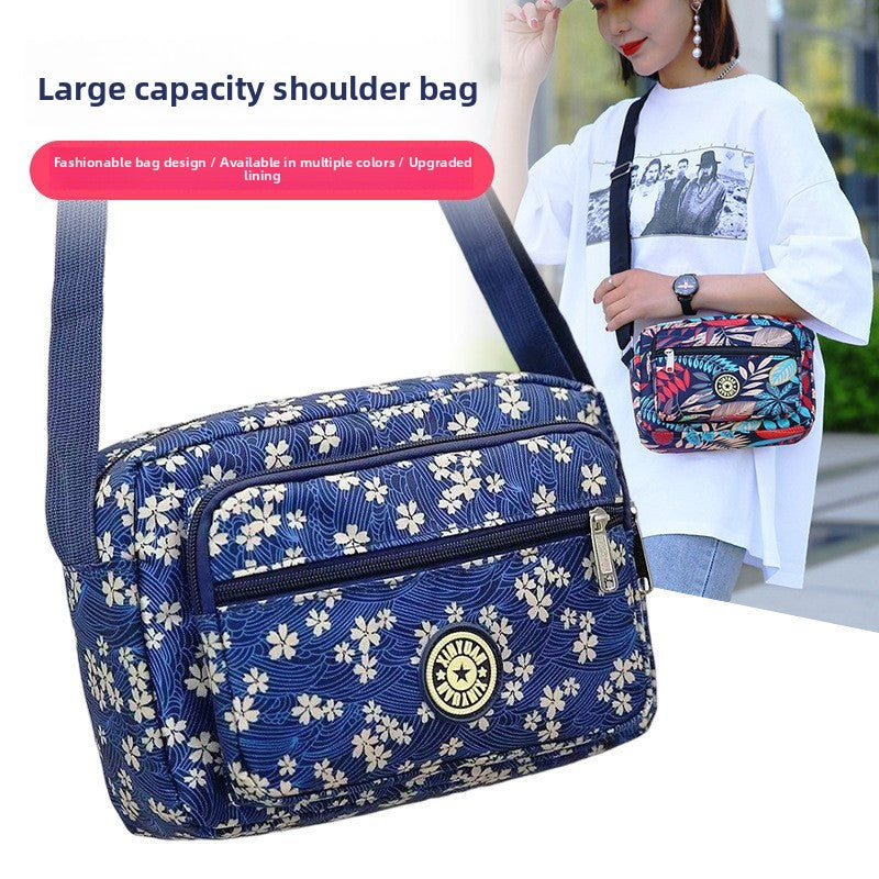 Small printed nylon crossbody bag with zipper, photo 1