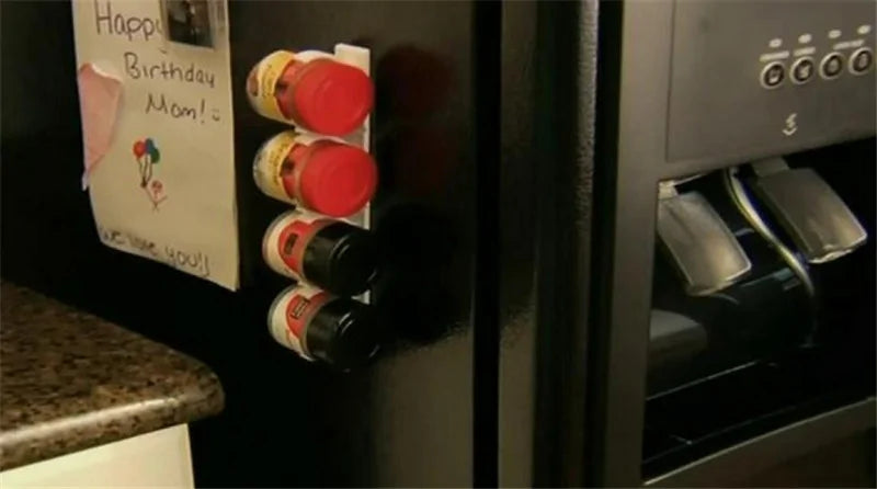 Clip shown mounted to the inside of a cabinet door for storage