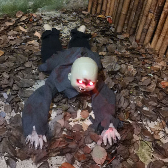 Crawling baby zombie doll with red eyes, second view