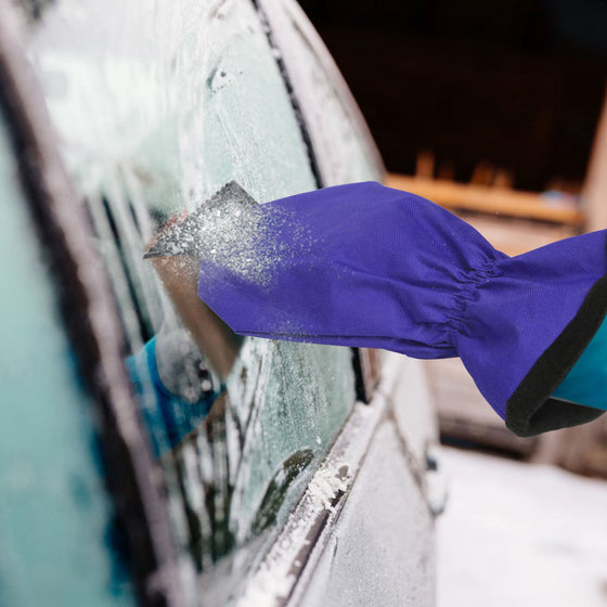 Purple ice scraper mitt clearing ice from a car window