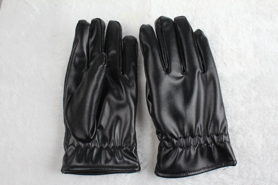 Pair of black PU leather gloves lying flat on a white surface