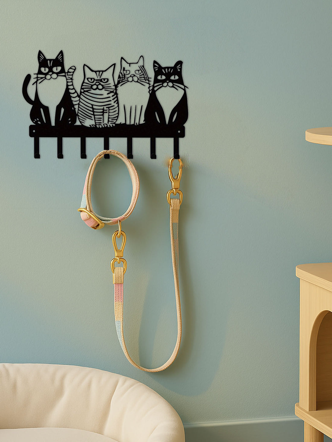 Cat wall hook rack holding a leash