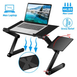 Foldable laptop desk on sofa with laptop and notebook