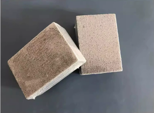 Grill cleaning brick scrubbing a grate