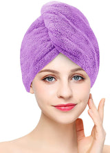 Purple coral fleece hair towel wrap worn on model with twist-and-tuck closure