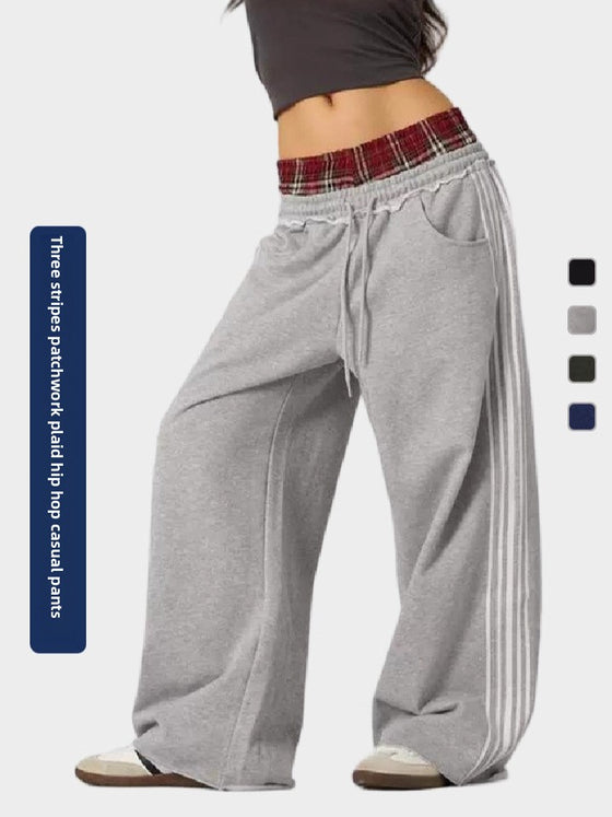 Gray wide-leg pants with a plaid waistband and drawstring