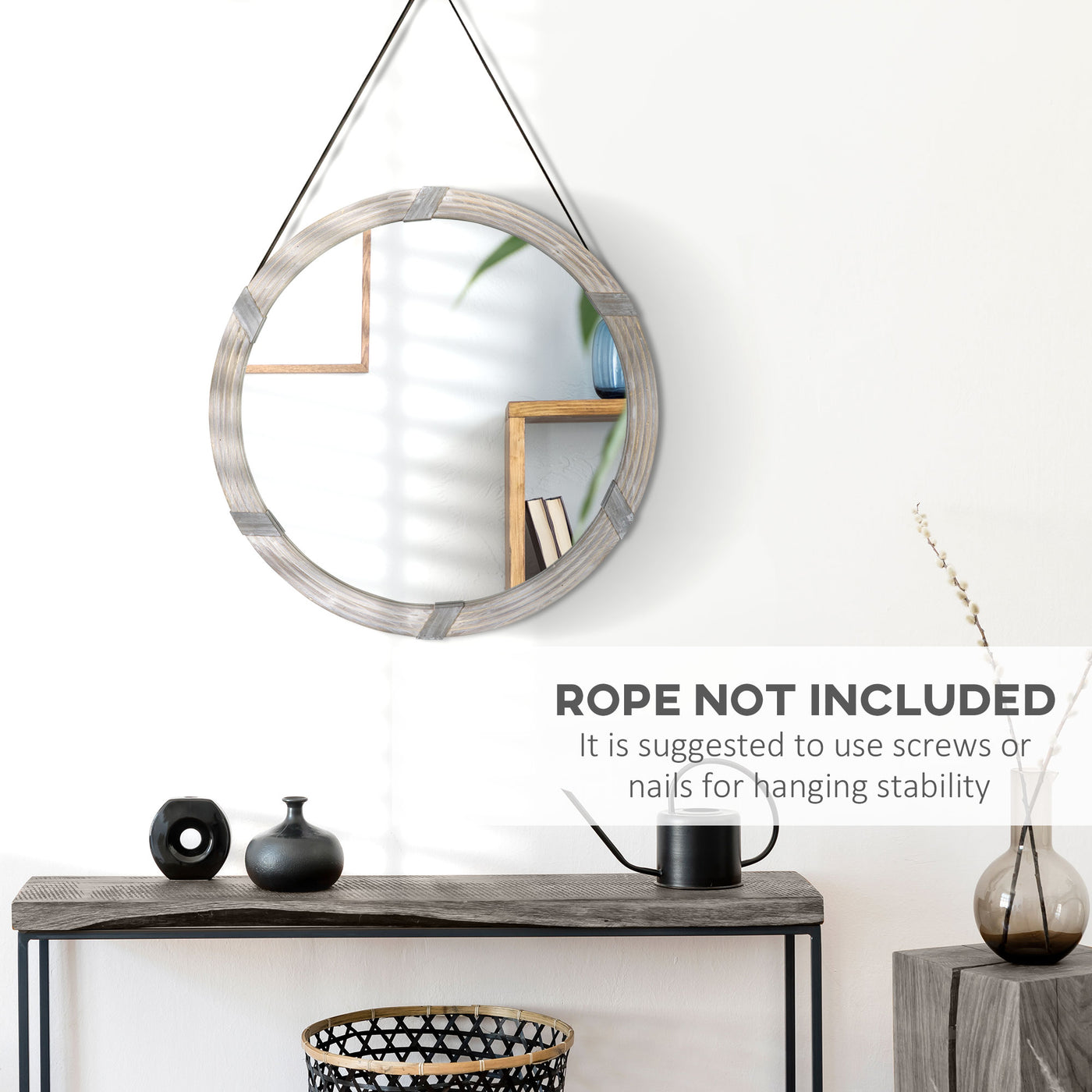 Round wood mirror hung above a bathroom vanity