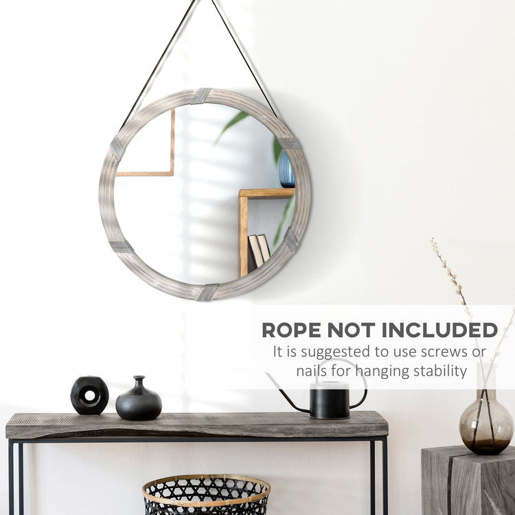 Round wood mirror hung above a bathroom vanity