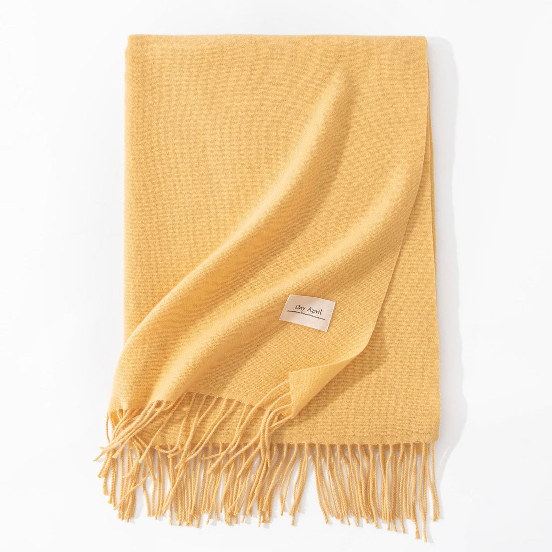 Light Yellow faux cashmere scarf with tassels, folded