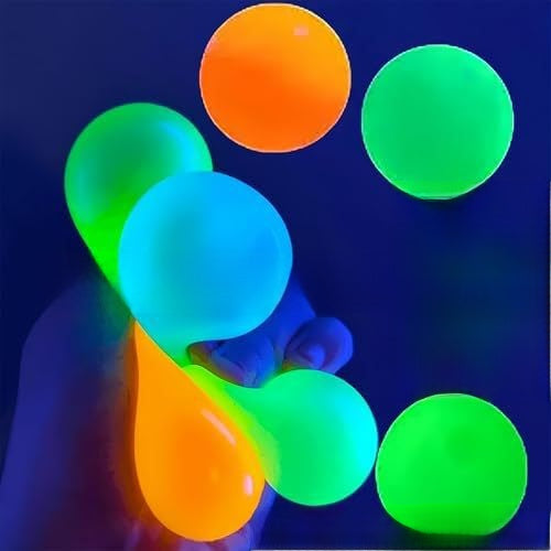 Glow-in-the-dark sticky squeeze balls stuck to a ceiling, photo 1