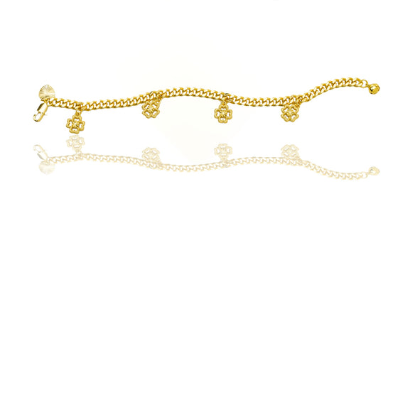 Gold four-leaf clover charm bracelet with reflection on a white background