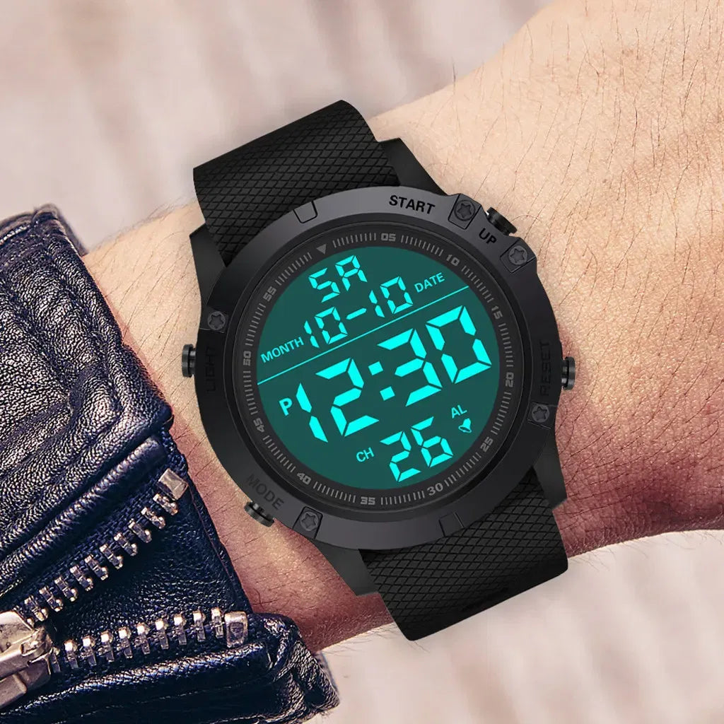 Man wearing the black digital watch with the blue backlight lit