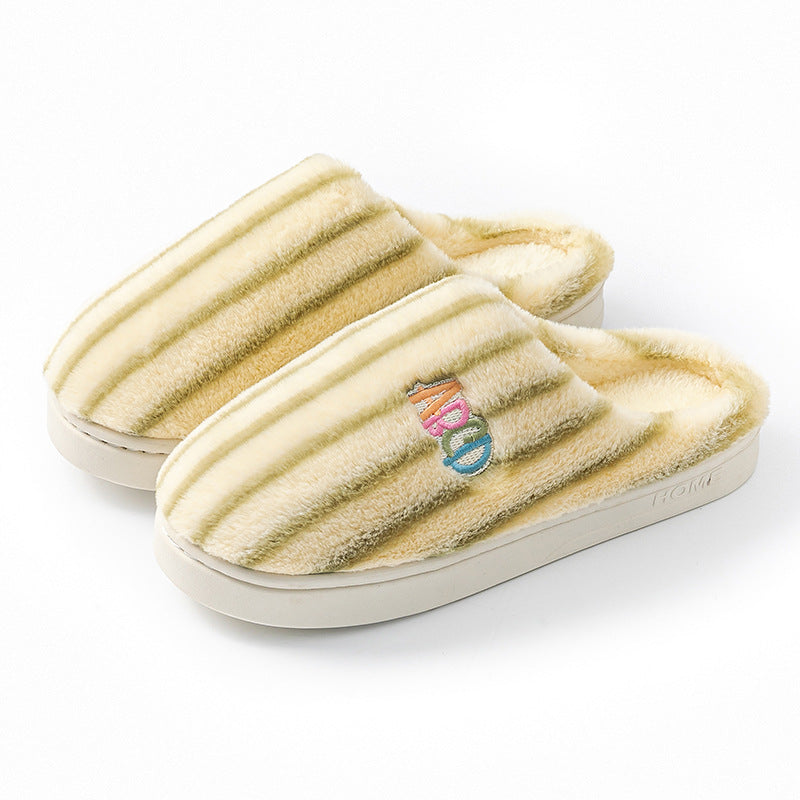 Green striped plush slippers with an embroidered letter patch