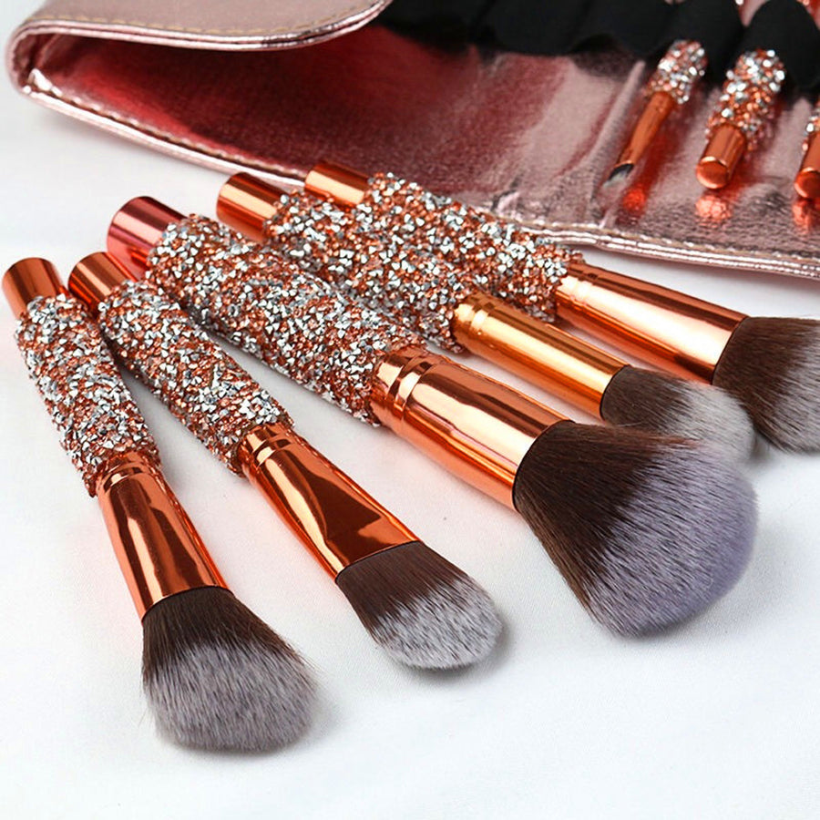Rhinestone makeup brushes laid out showing soft synthetic bristles
