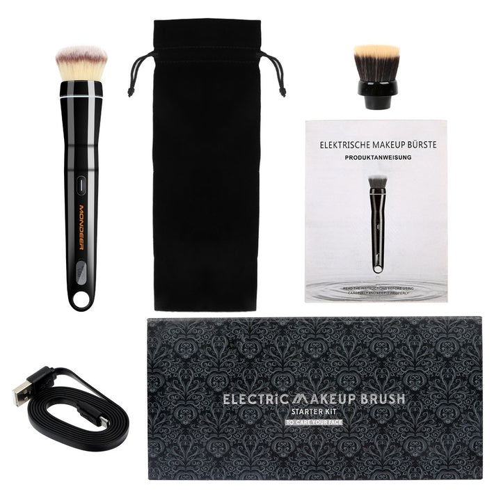 Portable electric makeup brush in hand for blending foundation