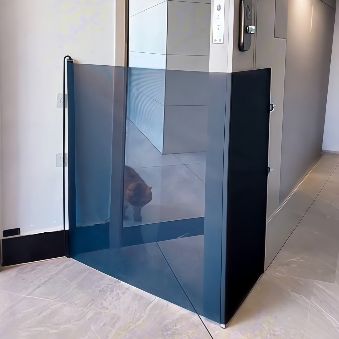 Black mesh pet gate extended along a hallway wall