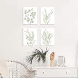 4-piece botanical canvas wall art set hung in 2x2 grid