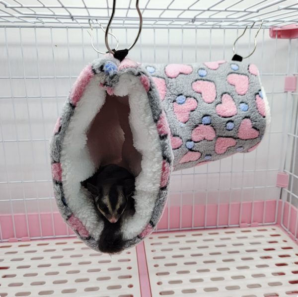 Plush tunnel nest size shown next to hand