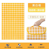 Picnic mat spread out on grass