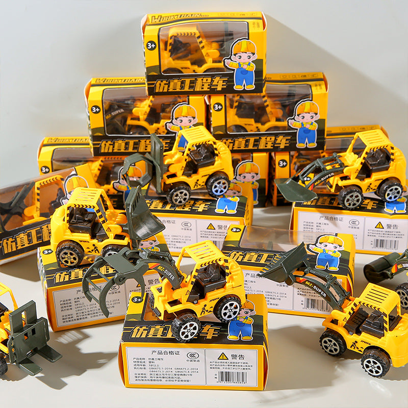 Miniature toy of a reversing engineering vehicle