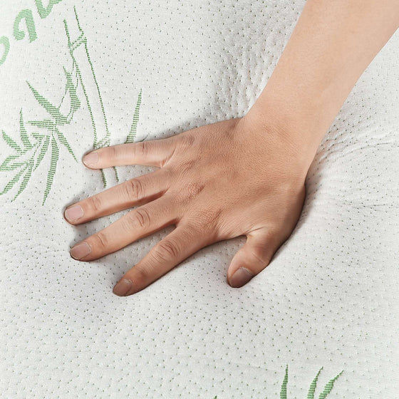 Hand pressing into the quilted pillow cover