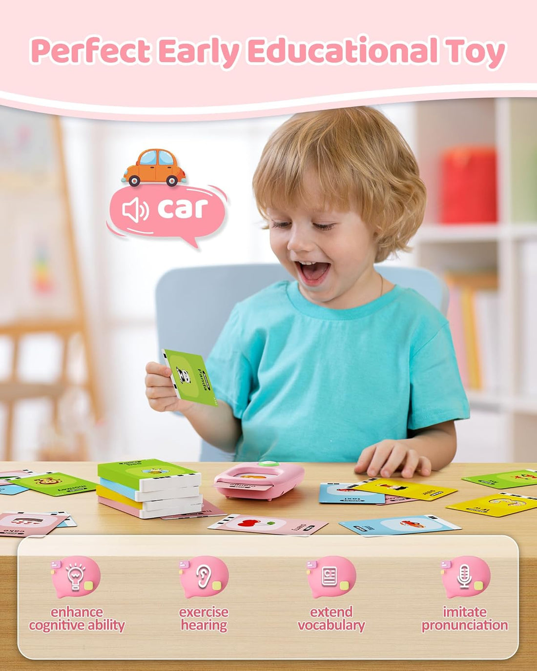 Smiling toddler holding a word card next to the flash card reader