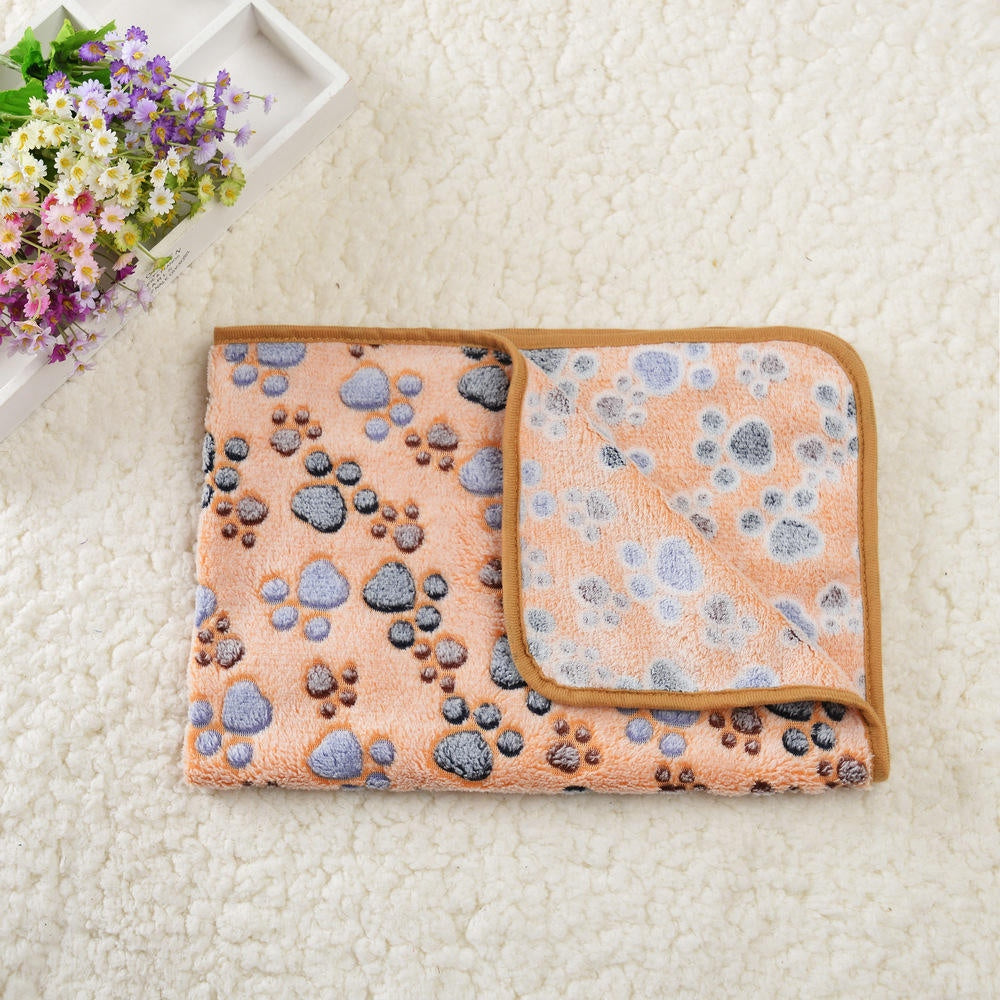 Tan paw print fleece pet blanket folded