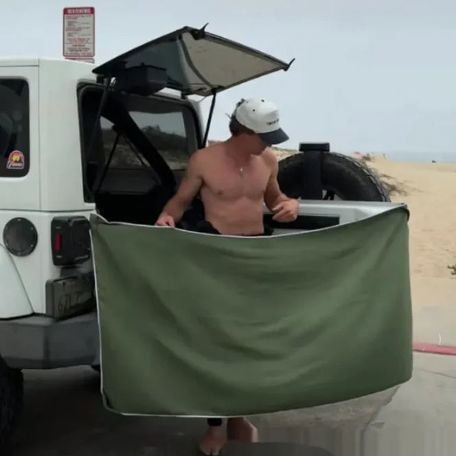 Magnetic changing towel attached to car