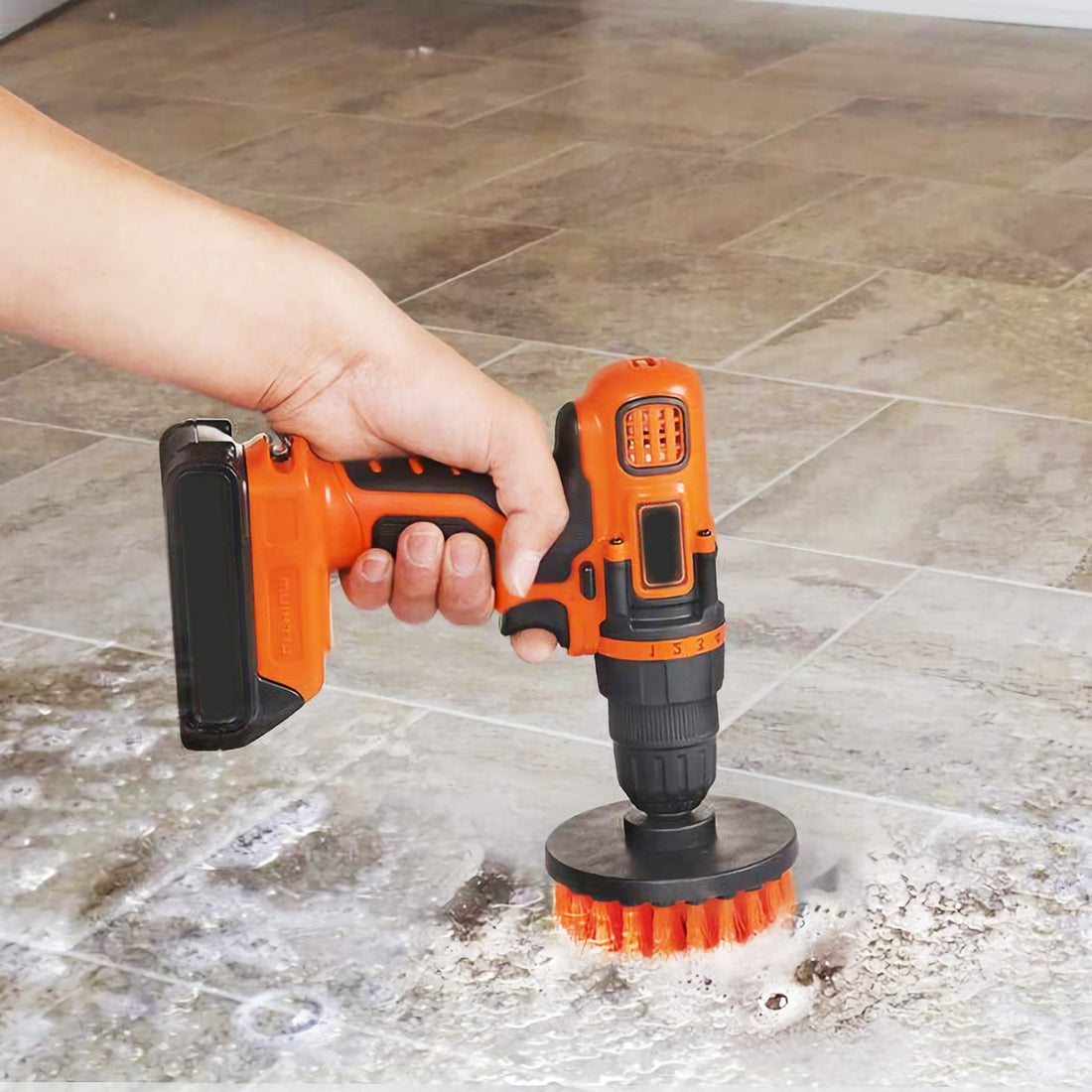 Drill scrubbing a floor with a red brush