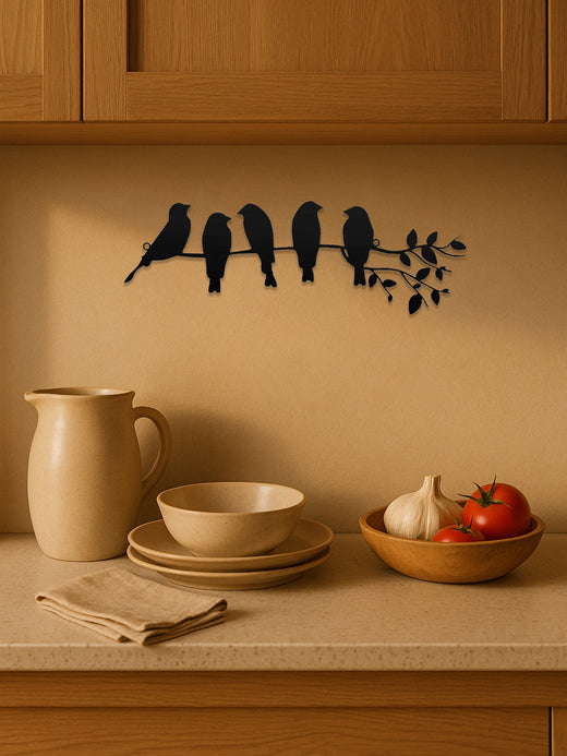 Close-up of cut-metal bird detail on wall art