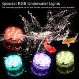 Submersible LED lights glowing in glass vases