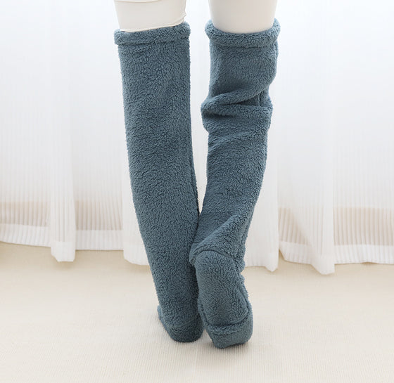 Dark blue over-the-knee fuzzy socks worn standing