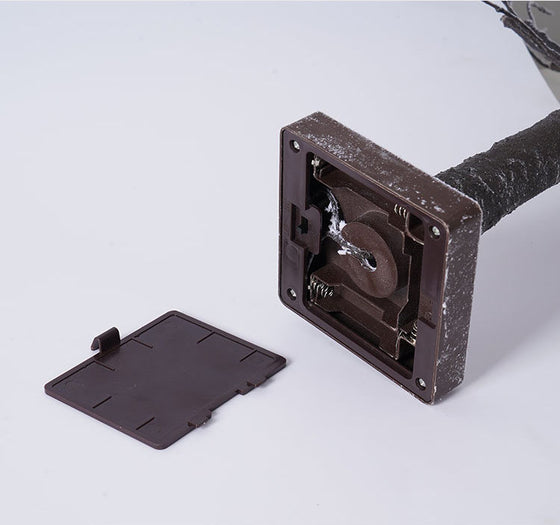 Close-up of the base and battery compartment of the LED birch tree light