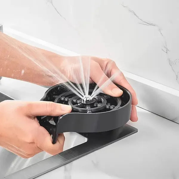 Automatic cup washer rinsing a glass in use