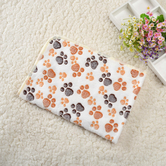 Cream paw print fleece pet blanket with brown paws