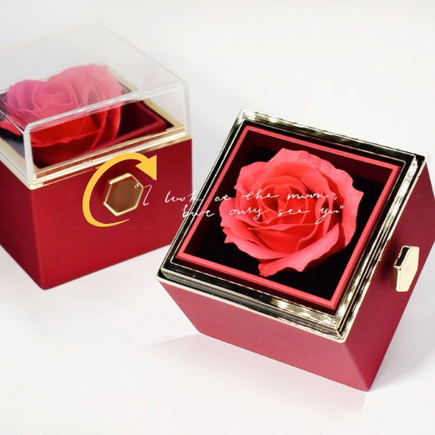Red rotating rose jewelry box with lid turned to show the spinning rose