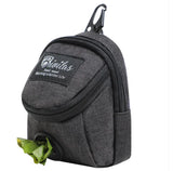 Pet fashion carrier worn over the shoulder with a small dog inside