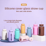 Insulated borosilicate glass cup with straw lid and silicone sleeve