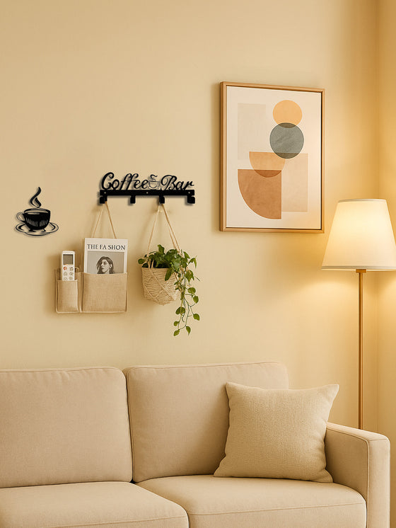 Coffee Bar sign above a sofa holding a plant